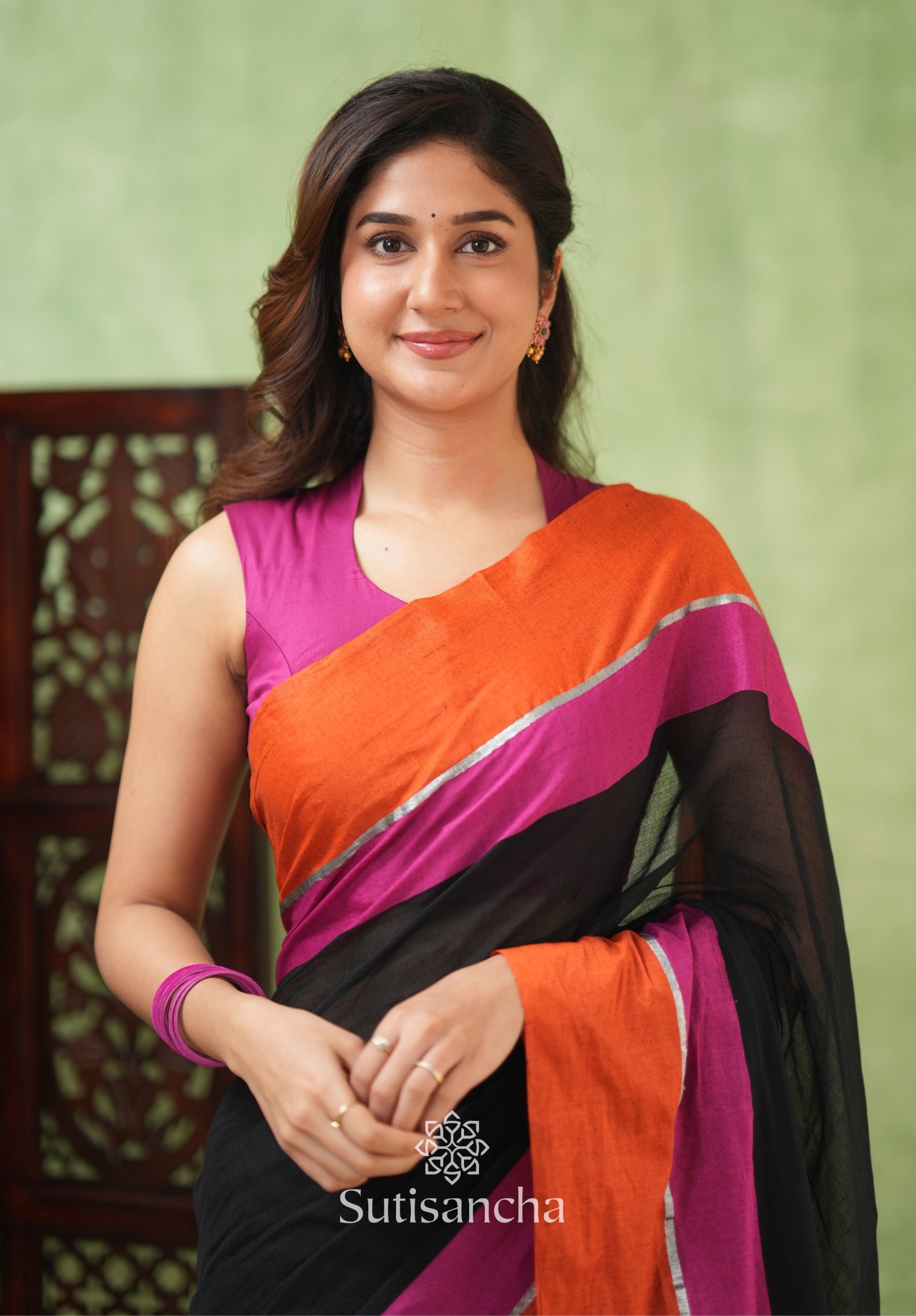 Fiery Flair Black & Orange Mul Cotton Saree with Tassel Edges